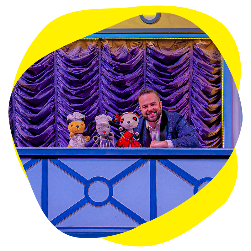 And image of Sooty Sweep and soo live on stage with a presenter