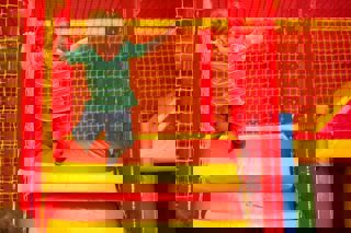 Kid Jumping In Play Area (1)(1)