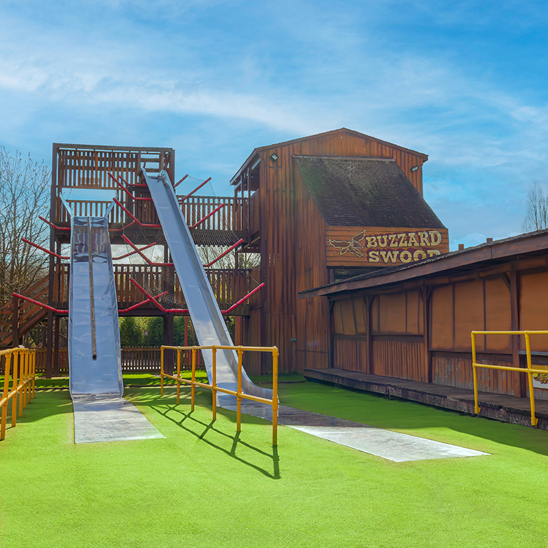 An image of giant outdoor slides at a theme park