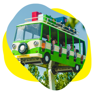 An image of a magic bus ride in the air at a theme park with blue skies