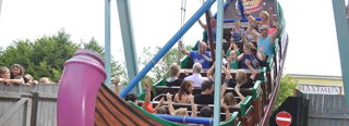A Group Of Families On A Swing Ride(1)